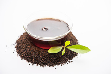 Black Tea Powder or dry dust with or without green leaf and served hot chai in a cup