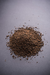 Black Tea Powder or dry dust with or without green leaf and served hot chai in a cup