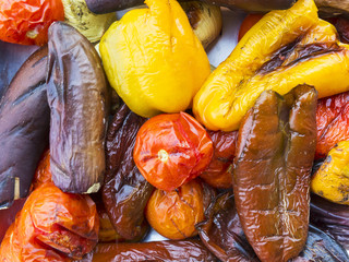 Grilled vegetables on a dish, top view, background