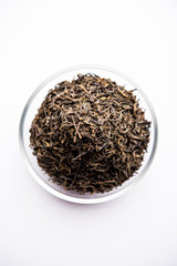 Black Tea Powder or dry dust with or without green leaf and served hot chai in a cup