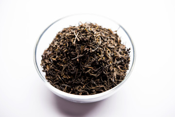 Black Tea Powder or dry dust with or without green leaf and served hot chai in a cup