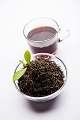 Black Tea Powder or dry dust with or without green leaf and served hot chai in a cup