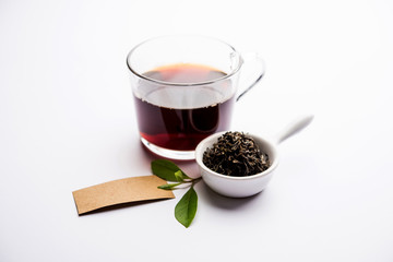 Black Tea Powder or dry dust with or without green leaf and served hot chai in a cup