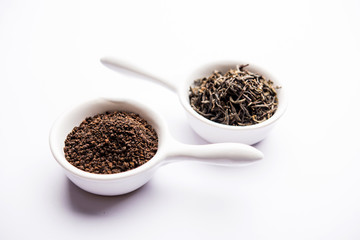 Black Tea Powder or dry dust with or without green leaf and served hot chai in a cup