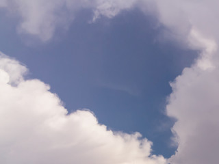 Obraz premium Beautiful white clouds in the blue sky, background, place for text.