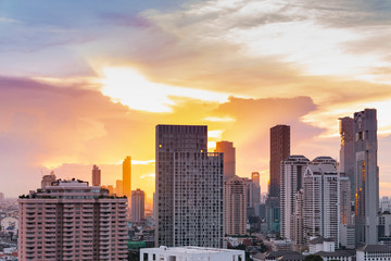 Fototapeta na wymiar cityscape Bangkok sunset skyline, Thailand. Bangkok is metropolis and favorite of tourists live at between modern building / skyscraper, Community residents