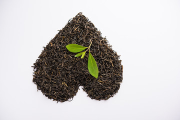 Black Tea Powder or dry dust with or without green leaf and served hot chai in a cup