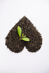 Black Tea Powder or dry dust with or without green leaf and served hot chai in a cup