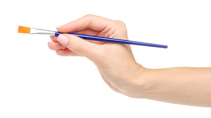 Paint brush in hand on a white background. Isolation