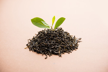 Black Tea Powder or dry dust with or without green leaf and served hot chai in a cup