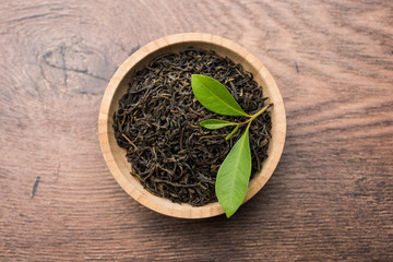 Black Tea Powder or dry dust with or without green leaf and served hot chai in a cup