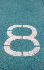 Fototapeta premium digit 8 on a blue athltetics track