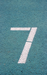 digit 7 on a blue athltetics track