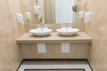 Modern sink in the Museum, marble wall.