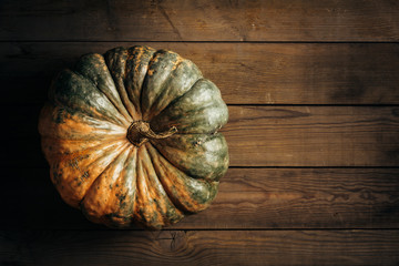 large pumpkin on wooden background