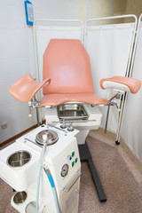 Gynecological cabinet with chair and other medical equipment in modern clinic