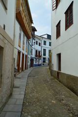 Fototapeta na wymiar Picturesque, narrow, curves and uphill streets in Castropol. August 2, 2018. Architecture, Nature, Travel. Castropol, Asturias, Spain.
