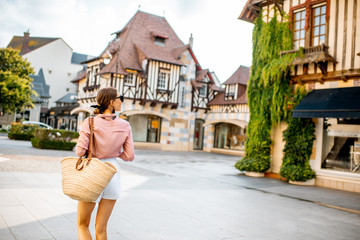Beautiful woman walking at the old town of Deauville, famous french resort in Normandy
