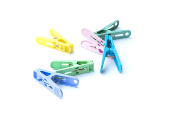 Pile of colorful clothespins isolated on white background