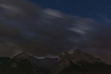 Clouds over mountain long time exposure nighttime