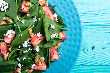 Strawberry salad with spinach , cheese and walnut