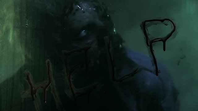 Horror zombie. Halloween party. Close-up portrait of a horrible scary zombie man in smoke.