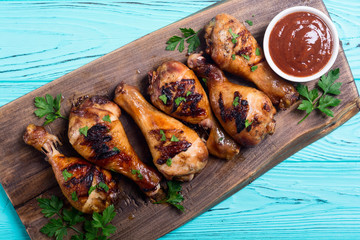 Grilled chicken legs with tomato sauce