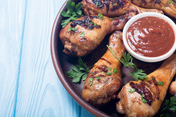 Grilled chicken legs with tomato sauce