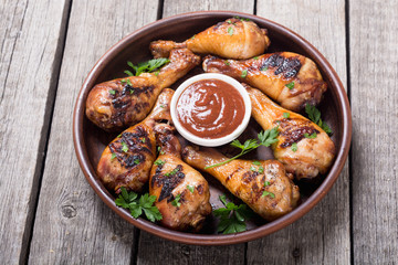 Grilled chicken legs with tomato sauce