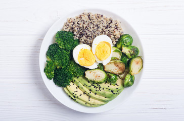 Buddha bowl with quinoa , eggs , avocado , brussels sprouts and broccoli