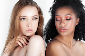 Caucasian and african teen girls close-up