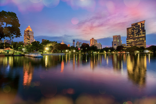 Lake view of Lumpini Park in the Thai capital's city centre with buildings in Bangkok © funfunphoto