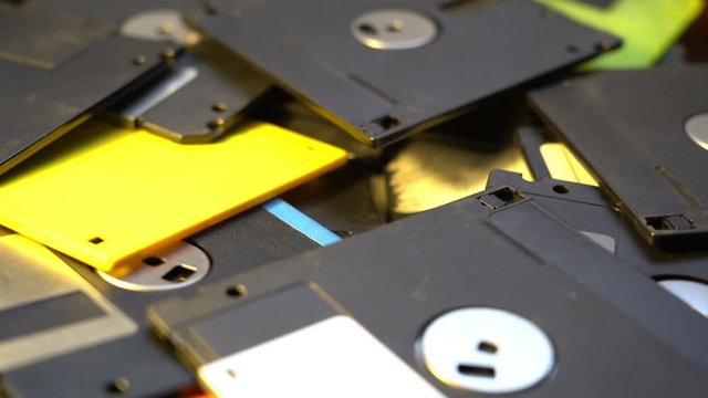 trowing up old diskettes data center concept background, pile of floppy discs in a garbage, outdated compute technology