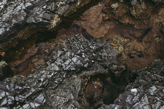 
Dark rock texture close up