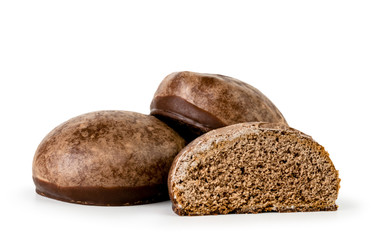 Chocolate gingerbread and half close-up on a white background.