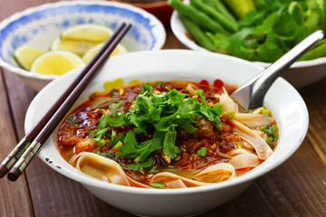  Lao khao soi, wide rice noodles soup with spicy minced pork, laos food
