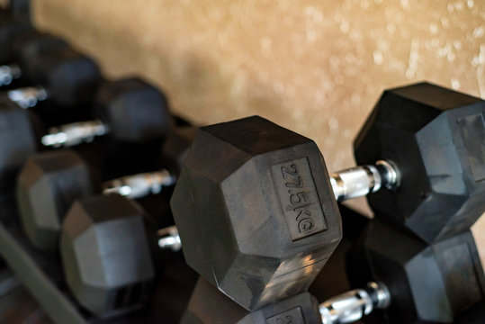 Close up image of chrome dumbbells in gym