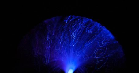 Abstract background a Optical fiber lamp. Closeup of colorful optical fibers