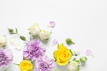 Flat lay composition with beautiful blooming flowers on white background