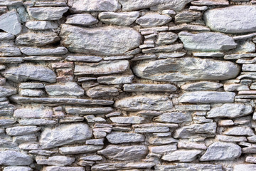 Front shoot of white colored masonry stone wall made by turkish wall craftsman