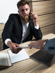Young bearded businessman in office late night work