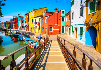 Fototapeta na wymiar Venice landmark, Burano island canal, bridge, colorful houses and boats, Italy.
