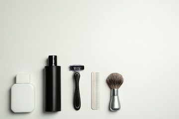 Flat lay composition with men's shaving accessories and space for text on white background