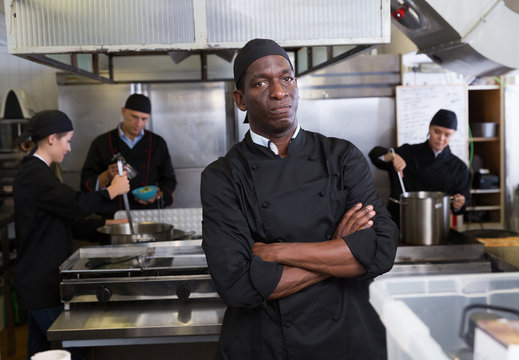 African-American chef in kitchen of restaurant