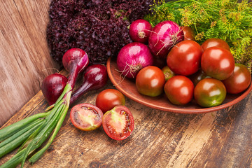 Composition of fresh vegetables on a wooden table