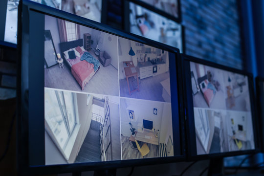 Modern monitors with video broadcasting from security cameras indoors. Safeguard's workplace