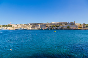 Fototapeta na wymiar Floriana, Malta. Shore bastions on the bay