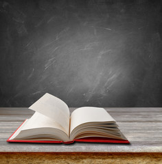 Book and blackboard