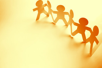 Paper chain team holding hands
