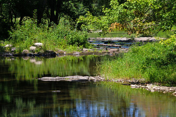 Fototapeta na wymiar Meandering waters of Sandy Stream in Unity Maine in the summer.